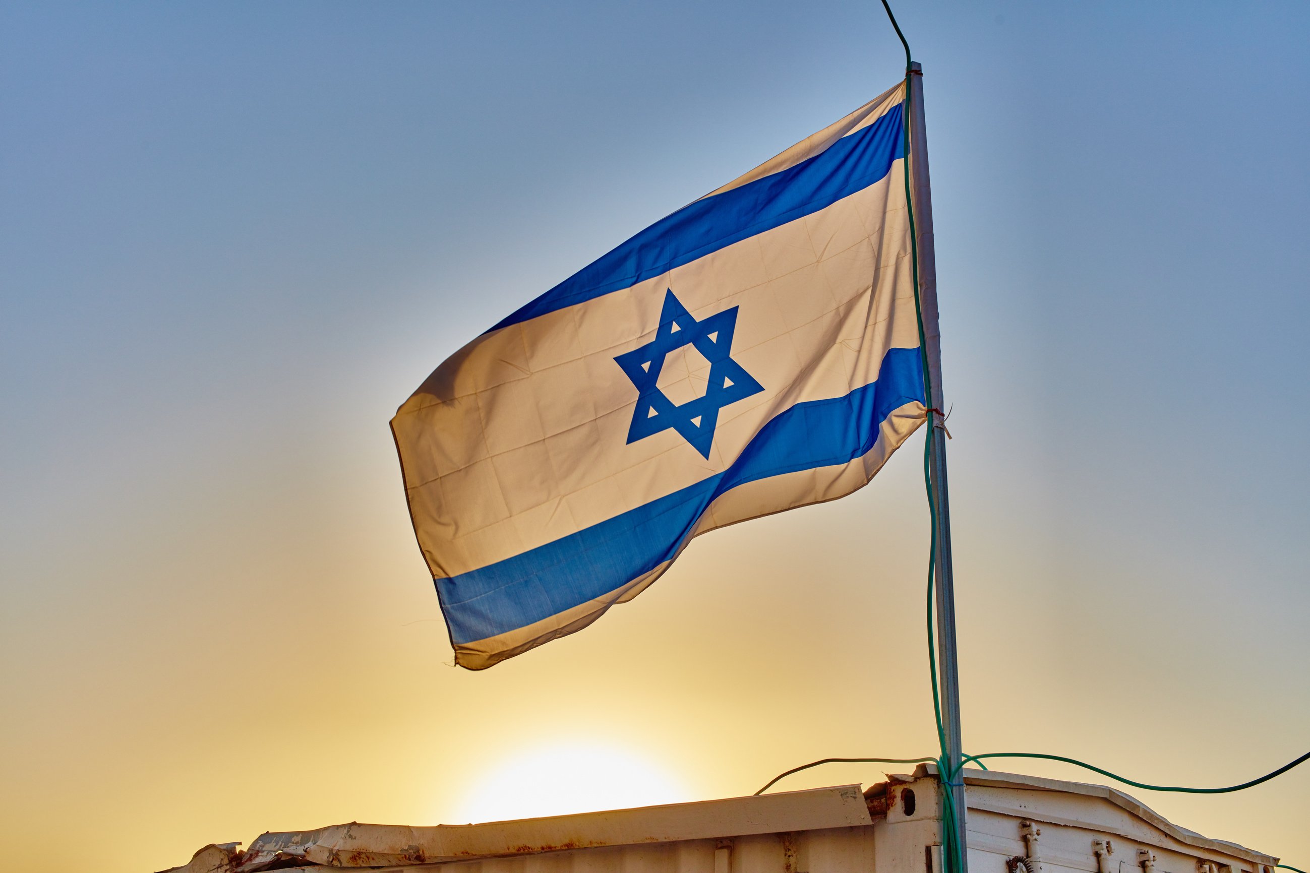 Israel flag at sunset